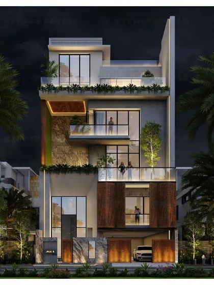 The same Pitampura project from a different angle, showing how the integrated lighting highlights the green wall and the texture of the facade materials.
