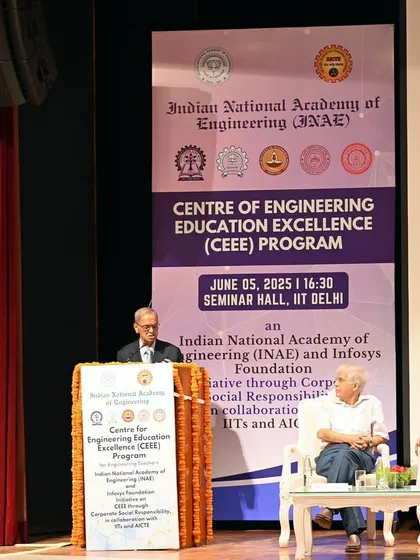 A wide shot of the stage at the IIT-Delhi event, showing the scale of the production and the context of the speaker's address.