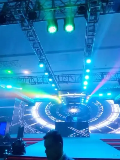 The stage during soundcheck, with a massive circular LED screen creating an impressive focal point.