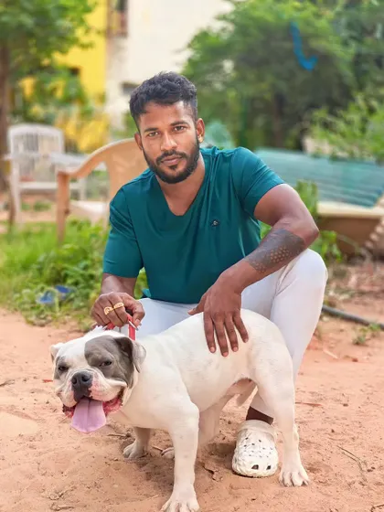 Me with a beautiful adult American Bully. This breed is strong and muscular but also very friendly and great with families.