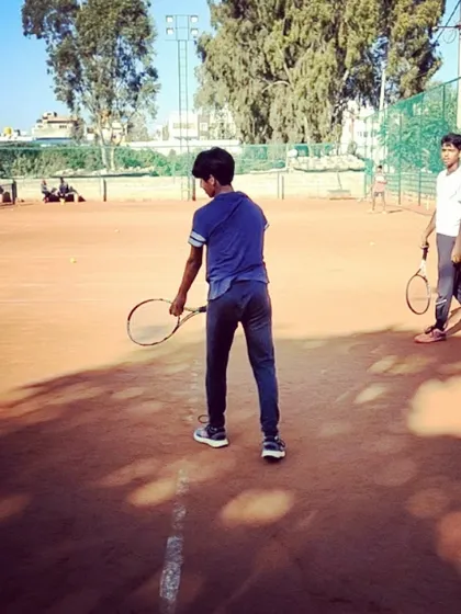 Two players during a practice match, focusing on strategy and point construction.