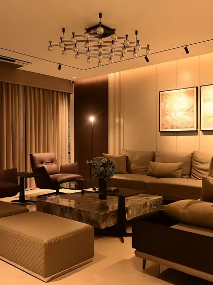 Another view of a completed living room, showcasing how warm, layered lighting can create an inviting atmosphere. Every light is controllable and dimmable.