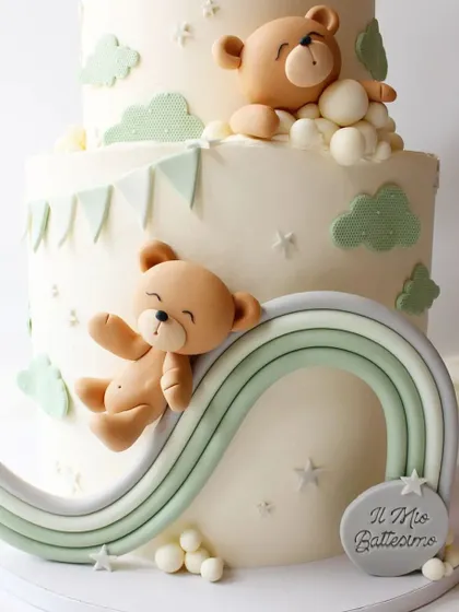 A detailed shot of the teddy bear sliding down a pastel rainbow.