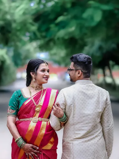 A look of love and shared dreams. This shot focuses on the couple's interaction during their traditional maternity photoshoot, highlighting their bond.