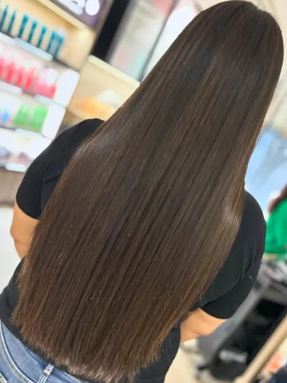 For her first time coloring her hair, we went with a beautiful, glossy look styled straight. This showcases the healthy, shiny result of using quality products like Fibreplex.