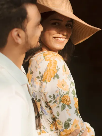 A beautiful, sun-kissed portrait of the couple, with the bride giving a lovely smile over her shoulder.