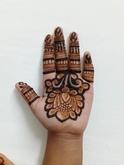 The fresh mehndi paste, showing the clean lines of the lotus design.