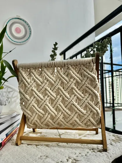 The natural cream color of the macrame holder complements any decor style.