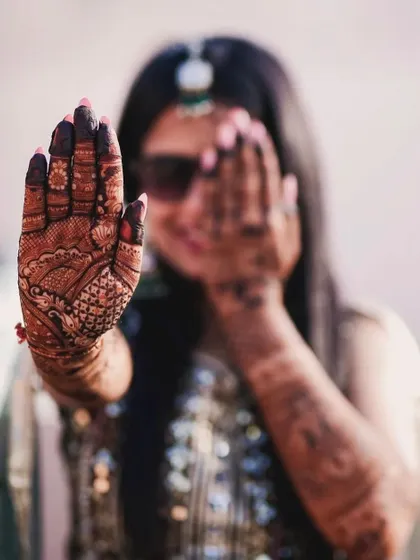 A cool shot of the bride showing her mehndi-covered palm.