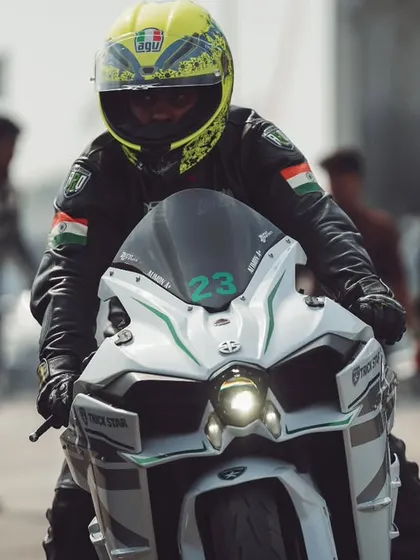 A rider on a Kawasaki Ninja H2, one of the most powerful production bikes in the world, smiles as they prepare for their run.