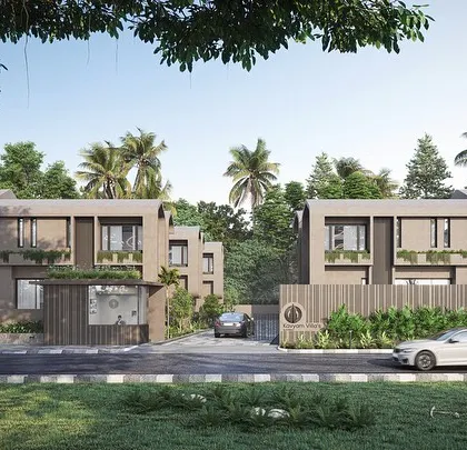 The entrance to the Vagator Villas community. The design uses simple, soft-edged forms and a muted color palette to create a welcoming and understated presence that respects the natural Goan environment.
