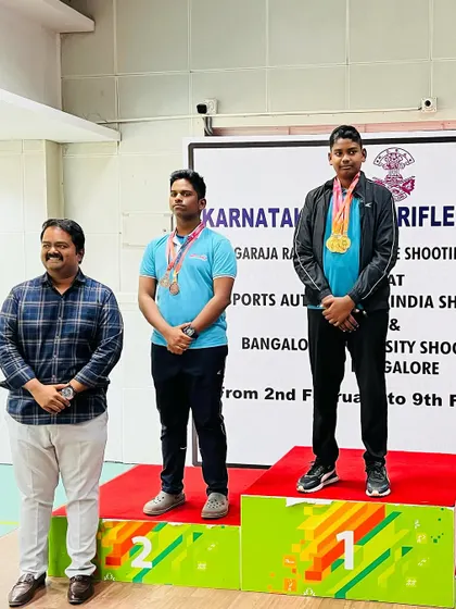 Darren and his teammate on the podium for the Air Pistol Men's event.