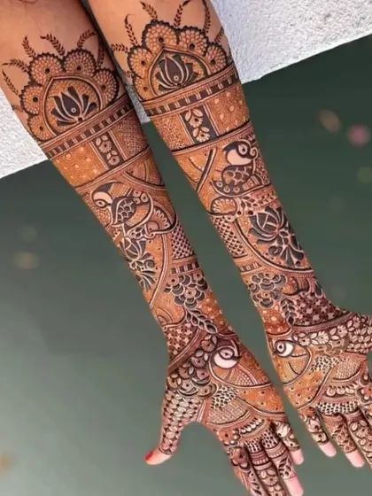 A graceful design featuring birds and lotus flowers, with clean lines and a beautiful flow from the hands to the arms.