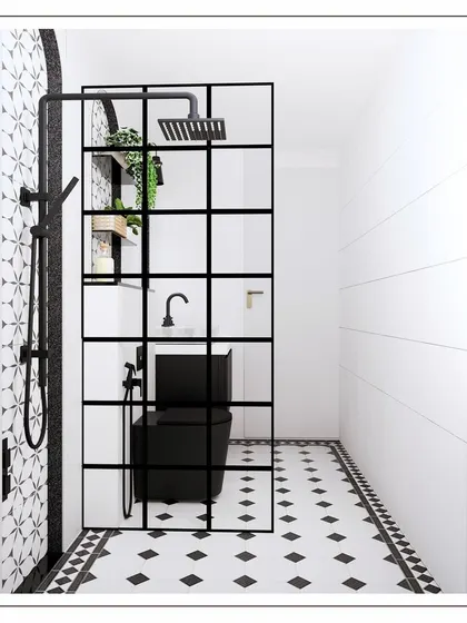 A view into the shower area, separated by a black-framed glass partition that adds an industrial-chic touch.