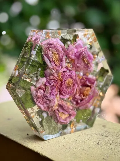 Another view of the hexagon flower block, showing the depth and clarity of the resin that encases the preserved pink roses.