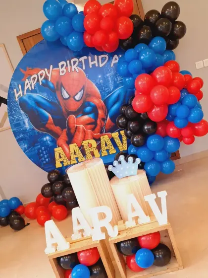 This view of the Spiderman setup highlights the marquee letters placed in wooden crates, adding a rustic and modern touch to the superhero theme.