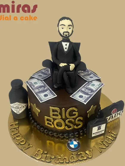 A cake for the "Big Boss." This design is all about luxury, featuring a figurine on a throne of money, a bottle of Hendrick's gin, and logos of high-end brands like BMW and Burberry.