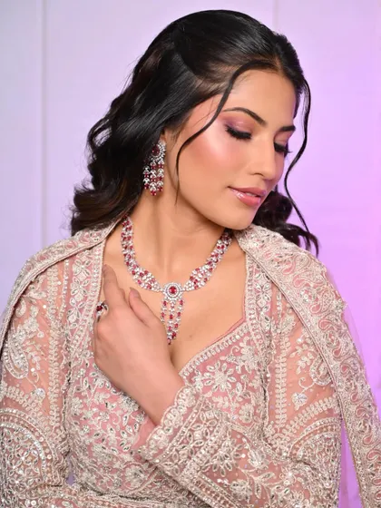 Another angle of the pink reception look, showing the delicate shimmer on the eyes and the soft hairstyle.