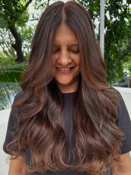 The happy client, loving her delicious new hair color. That smile is the best reward.