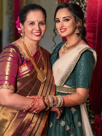 A beautiful pre-wedding portrait of the bride with her mother. Both look absolutely elegant and happy.