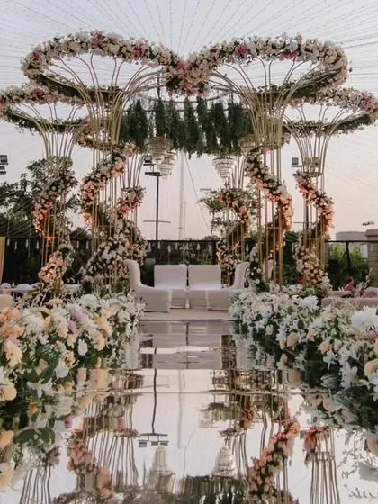 This is the canvas where your forever begins. I designed this grand pastel mandap with cascading florals and a mirrored aisle to feel like stepping into a real-life fairytale, perfect for an unforgettable outdoor wedding ceremony.