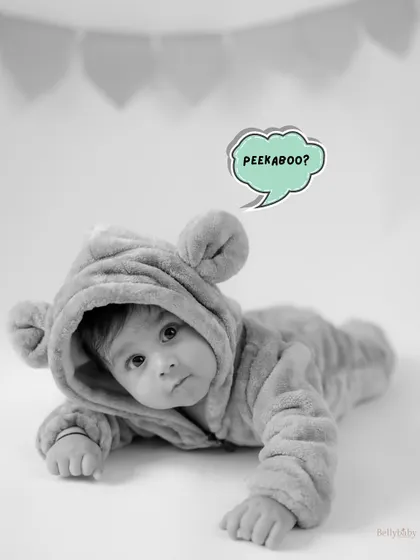 Peekaboo! A fun, edited black and white shot of our baby bear, capturing a moment of playful curiosity.
