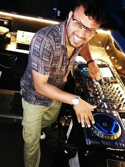 A happy moment behind the decks at Wheelhouse. I'm passionate about creating a fun and welcoming atmosphere on the dance floor.
