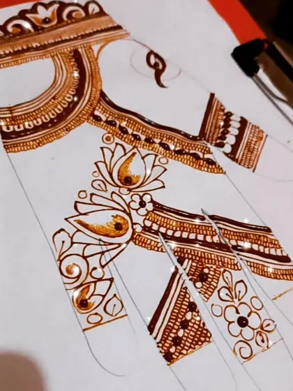 An in-progress design on a practice hand sheet. This shows how to build up a design on the fingers and connect it to the main pattern on the palm.