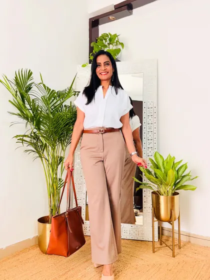 The classic white shirt and khaki trousers look. This is a timeless and professional outfit that never goes out of style.