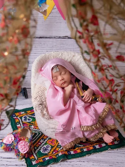 Here is our "choti si punjaban aur uska swag!" I love celebrating regional cultures, and this traditional Punjabi suit, complete with a phulkari-style mat and tiny jutti, makes for an incredibly vibrant and personal portrait.