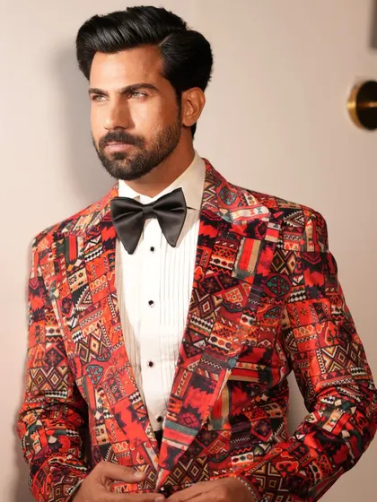 The detailed pattern of the Cantaloupe Tuxedo jacket, designed for the fashion-forward groom or event attendee.