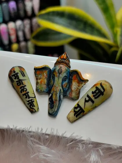 Celebrating Ganesh Chaturthi with divine nail art. This intricate, hand-painted 3D Ganpati design is a sample of the detailed festive art we teach.