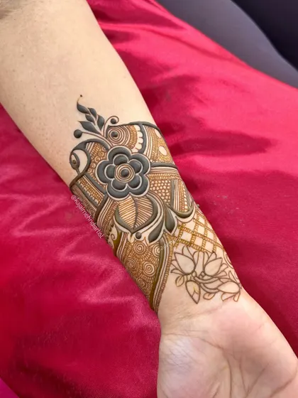 A slightly different angle of the floral forearm piece, showing the delicate line work.