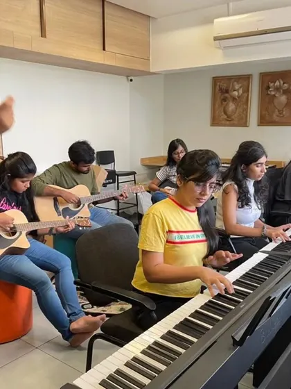 A group of participants learning together in our workshop. We use a mix of instruments to give everyone a chance to find what they connect with.