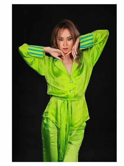 Another pose from the green loungewear lookbook. This shot shows the outfit from a different angle, highlighting its comfortable yet stylish design.