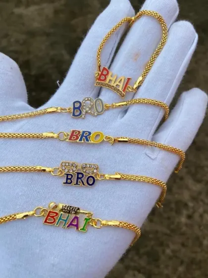 A full view of our fun and colorful "BHAI" and "BRO" rakhi bracelets, perfect for showing your brother some love with a bit of bling.