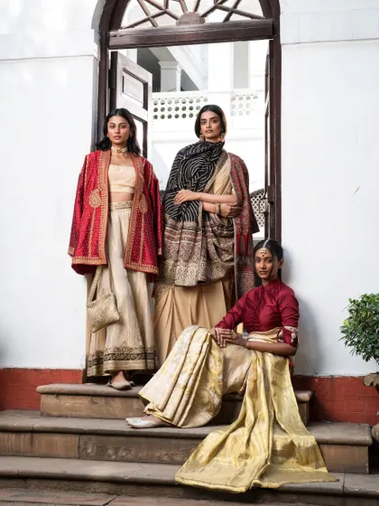A group shot showcasing a variety of trousseau-worthy outfits. From a lehenga with a jacket to layered sarees, this demonstrates how I build a versatile and coordinated wardrobe.