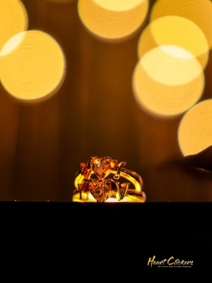 A creative shot of the couple's rings with a beautiful bokeh background, symbolizing their sparkling future together.
