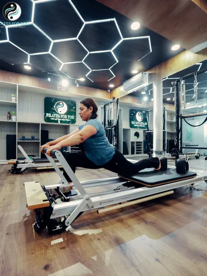 The single thigh stretch on the Reformer is a fantastic way to open up the hip flexors and quads. It improves flexibility and helps maintain a neutral spine.