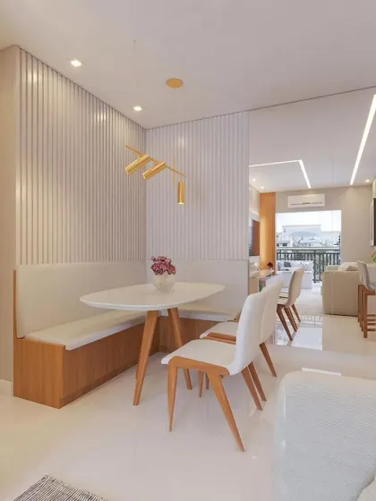 A cozy dining nook with built-in bench seating and fluted wall paneling, demonstrating our ability to create functional and stylish solutions for smaller spaces.