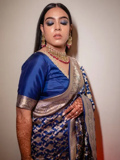 A close-up of the blue smokey eye makeup, which was the centerpiece of her reception look.