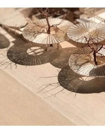 A detailed physical model of The Atelier's canopy system, demonstrating our hands-on approach to design. We study the intricate patterns of light and shadow, known as a moiré effect, to ensure our architectural elements create the intended atmosphere and visual poetry.