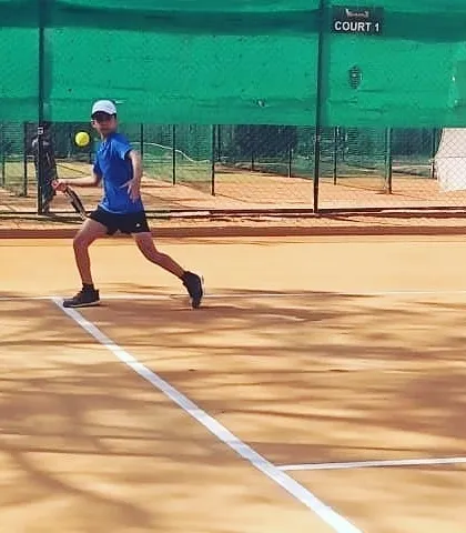 A junior player hitting a forehand with precision on Court 1 during the UTR tour.