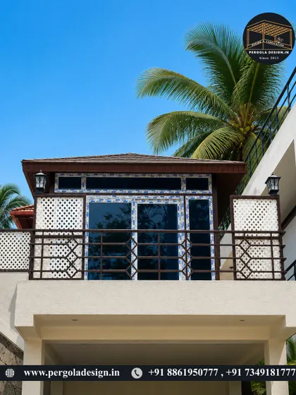 This exterior shot showcases how our glass room integrates perfectly with the existing architecture, turning an open balcony into a premium, usable space with elegant lighting and a durable, shingled roof.