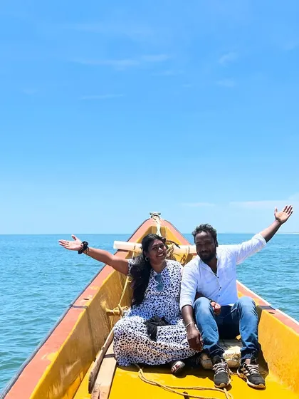 A happy couple enjoying their private boat ride against the backdrop of the open ocean. It's a perfect escape and a unique way to celebrate together.