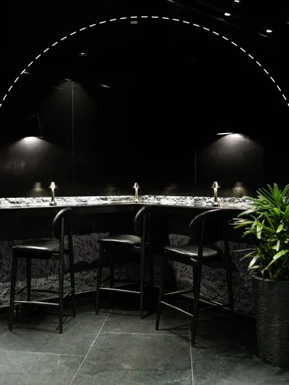 This is your corner of the Lair. Our design is intentional, creating intimate spaces with low lighting and modern textures for private conversations and memorable nights.