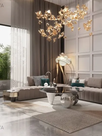 This lounge area was designed in response to the room's natural light and volume. We used layered lighting, including a statement chandelier, and a paneled wall to add texture and rhythm, creating a space that is both expansive and grounded.