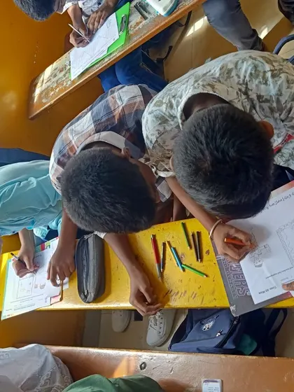 Students at Amara Vidya Niketan are deeply focused on their drawings. This image captures the quiet concentration that is a crucial part of the creative process, helping children develop patience and attention to detail.