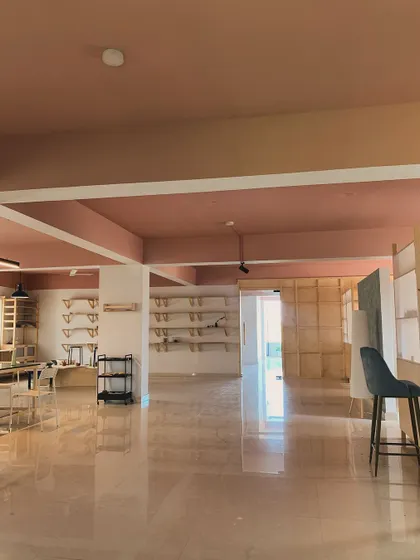 An empty studio holds so much potential. This wide shot shows the scale of our space, which we've grown into from a small terrace with a single wheel.