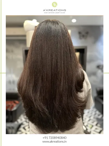 The "after" result of our chocolate brown color service, showing rich, deep, and glossy hair.